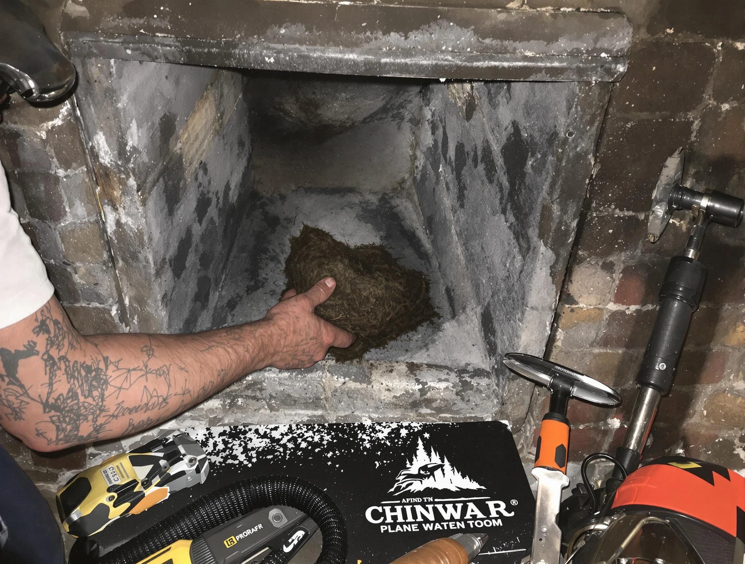 North Decatur Chimney Sweep safely removing debris and screening chimney in North Decatur, GA
